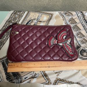 Michael Kors Soft, leather clutch, quilted, embellished burgundy color.